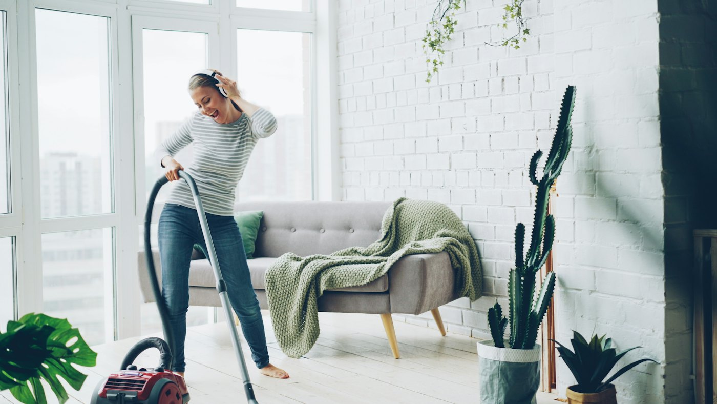 A happy homeowner enjoying a clean living room