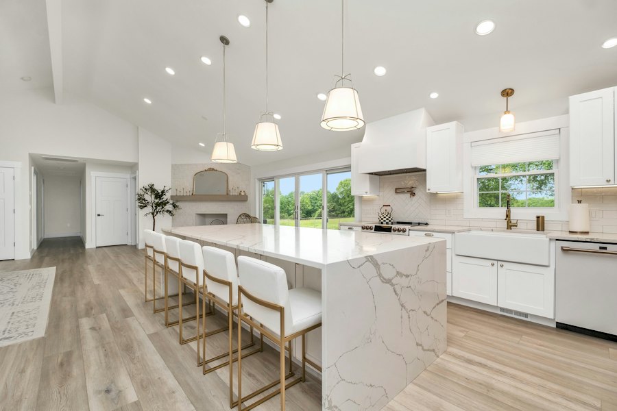 Clean kitchen with marble island